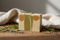 Aloe Glow Soap Bar with aloe vera and goat milk ingredients on a white surface with natural lighting